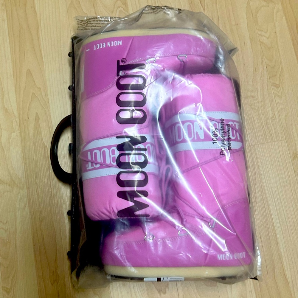 Brand new authentic pink Moon Boots, US size 7